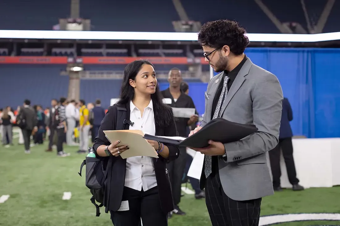 Two people at the Career Fair.